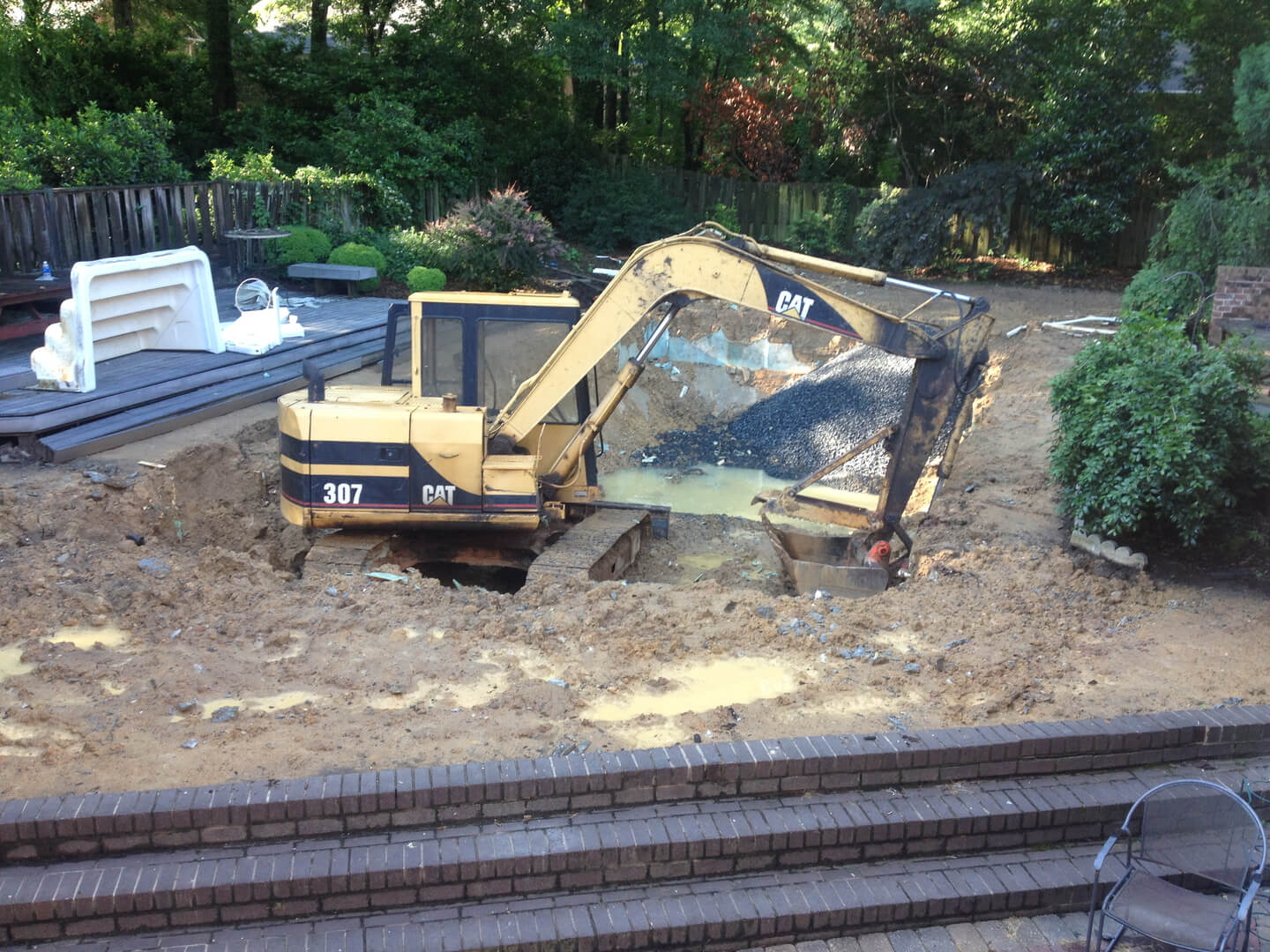 an excavator for the swimming pool construction